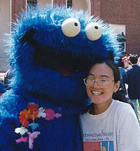 janet and cookie monster locked in a heated embrace